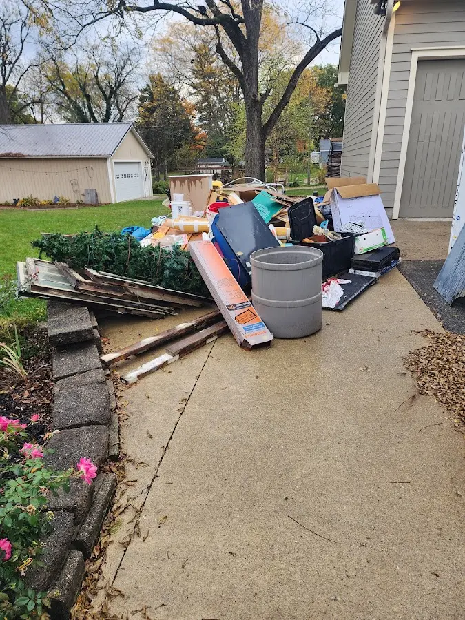 Dumpster being loaded with debris for 30 Yard Dumpster Rental in Swainsboro